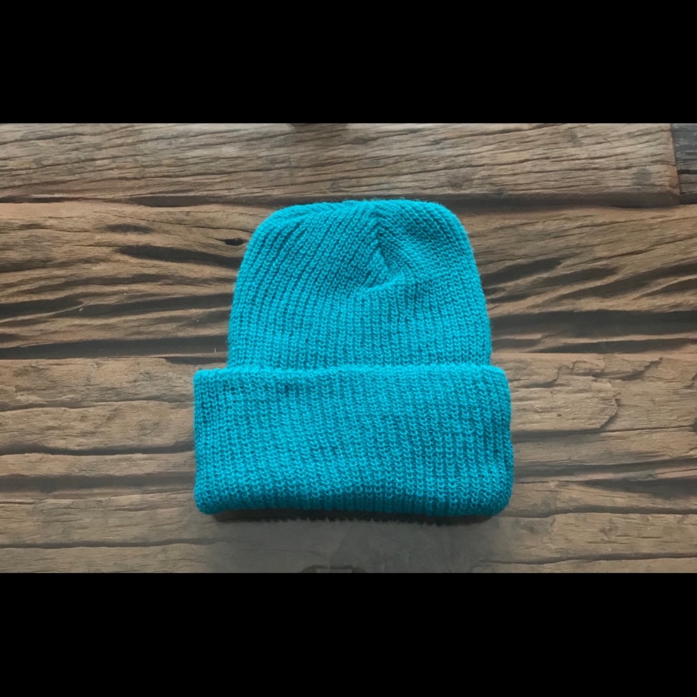 Winter hat. Dark teal color. Knitted hat.